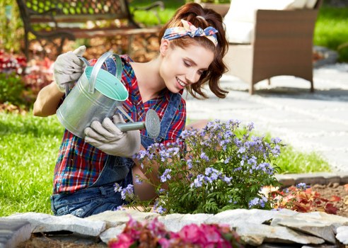 Gardener assessing a Stratford front garden
